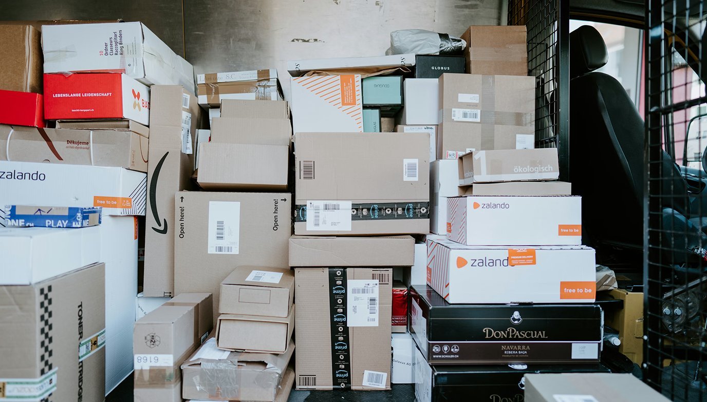 Delivery truck packed with parcels from major e-commerce retailers